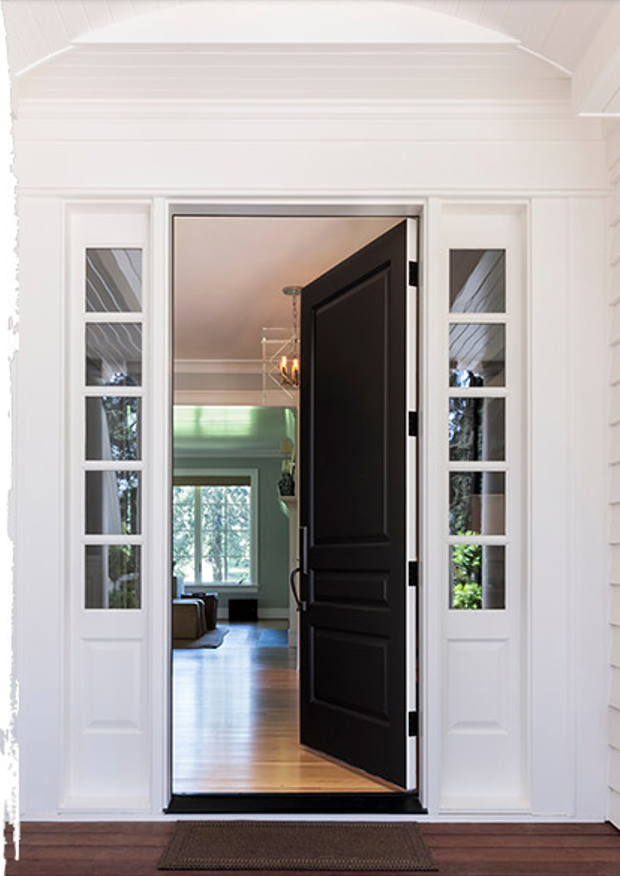 An open front door leading into a house